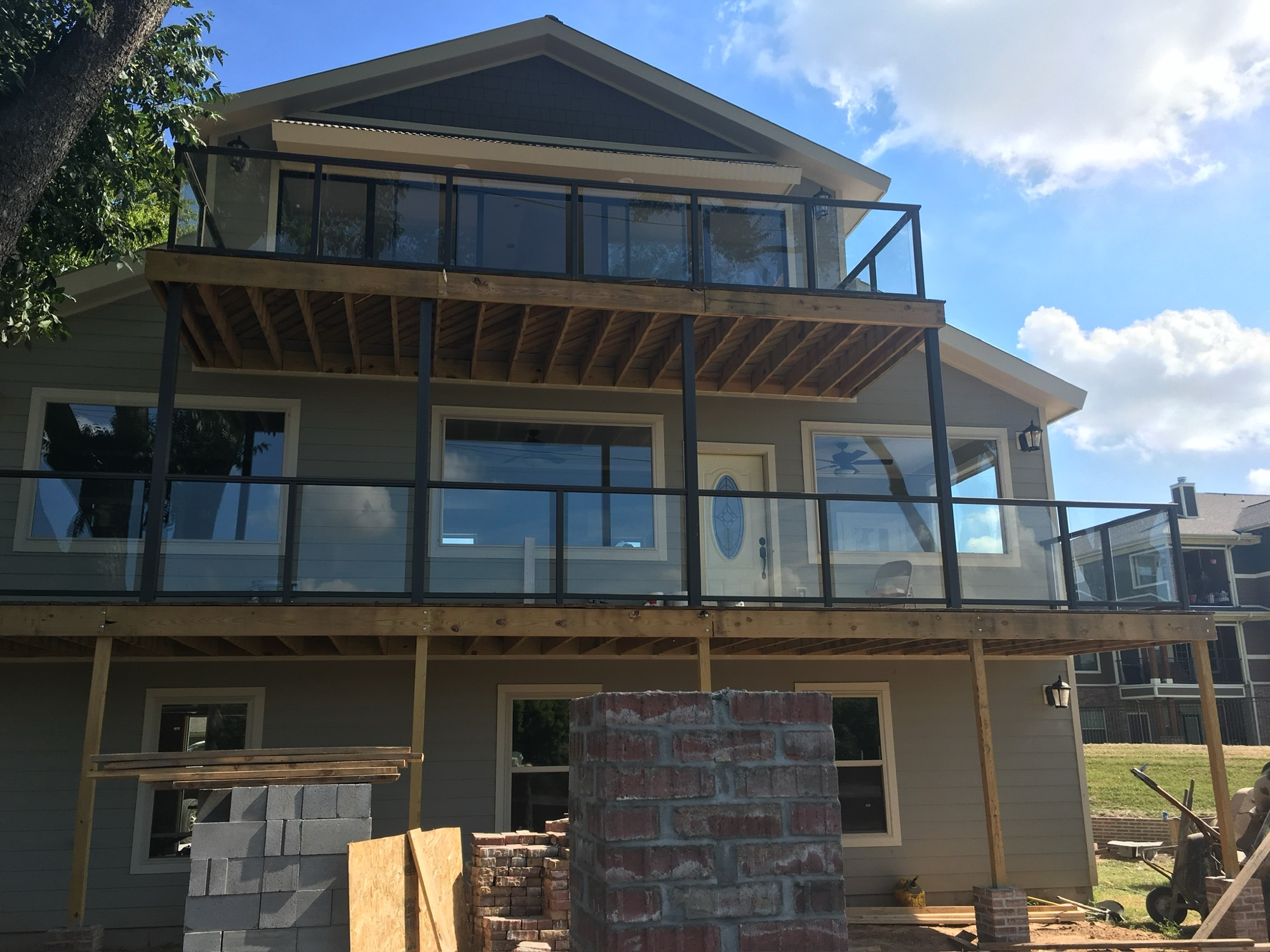 Multi-level glass handrails installation on a Little Rock lake house by West Little Rock Glass